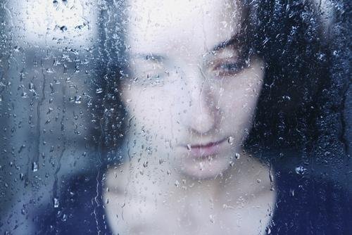 sad-woman-rainy-window